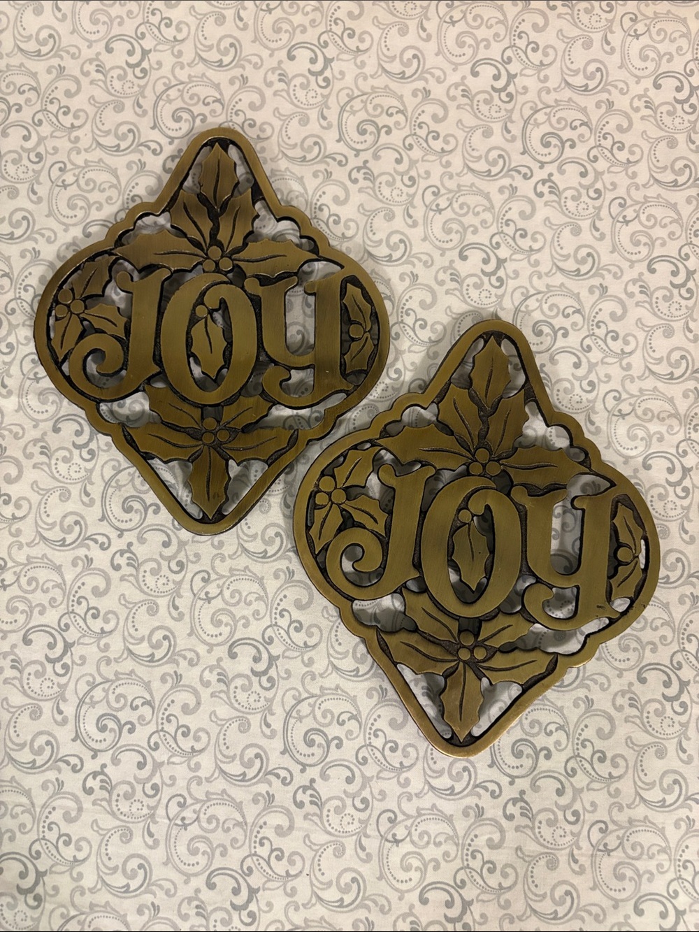 Bundle of 2 Vintage Avon Holly and Joy Cast Iron Trivets / Wall Hangs